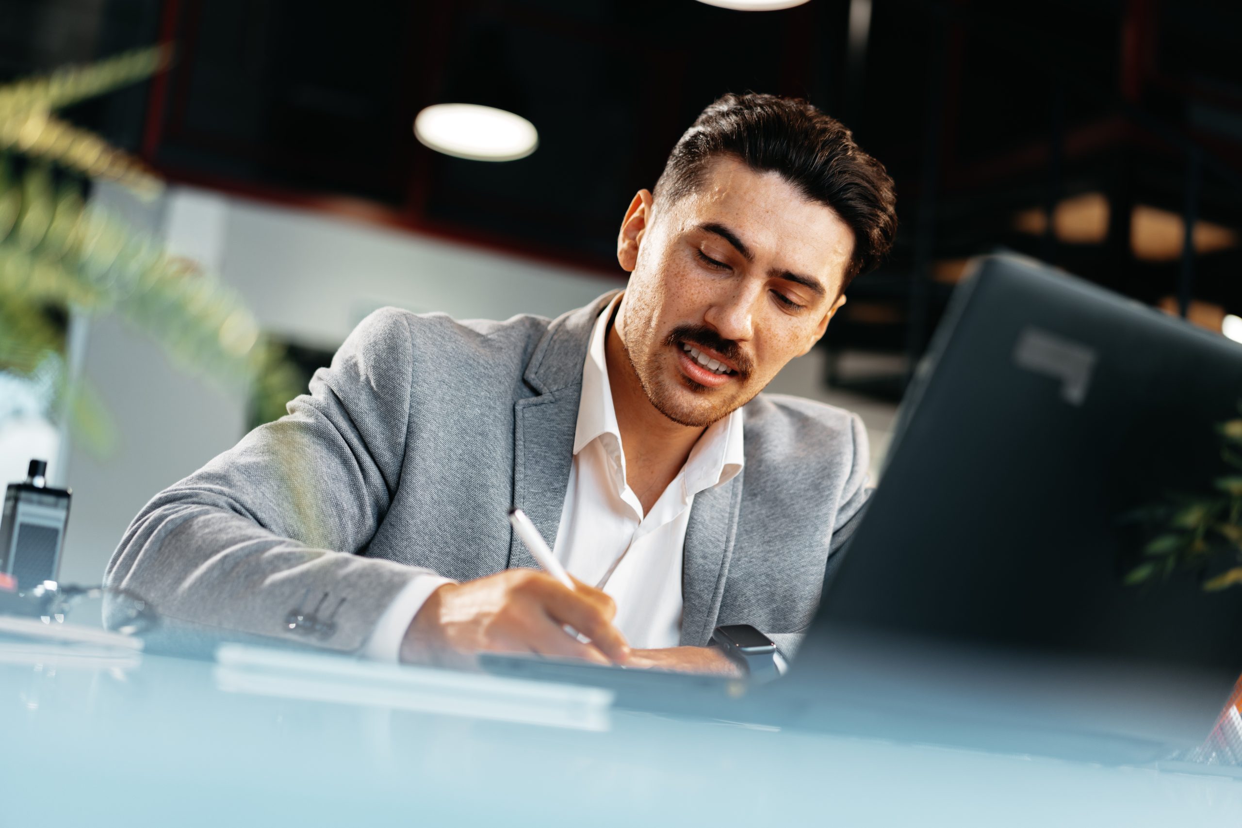 young arab businessman working at the table in modern office